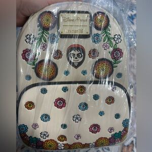 Loungefly Coco Beige Backpack with Colorful Floral and Skull Design